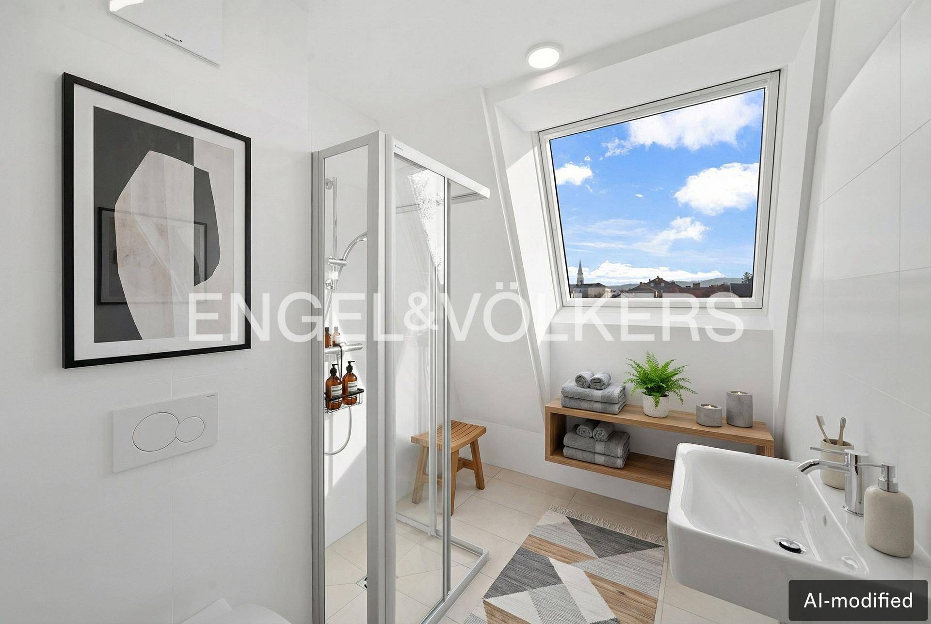 Modernes Badezimmer mit Dusche, Waschbecken und Dachfenster, bietet Weitblick.