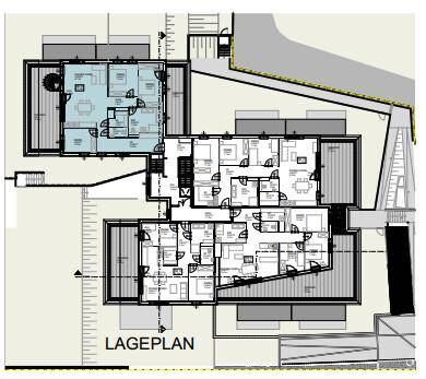 Lageplan der Wohnanlage mit der Anordnung der verschiedenen Wohneinheiten und Außenbereichen.