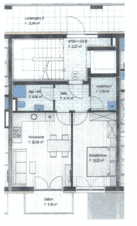 Grundriss einer Wohnung mit Wohnküche, Schlafzimmer, Bad und Balkon.
