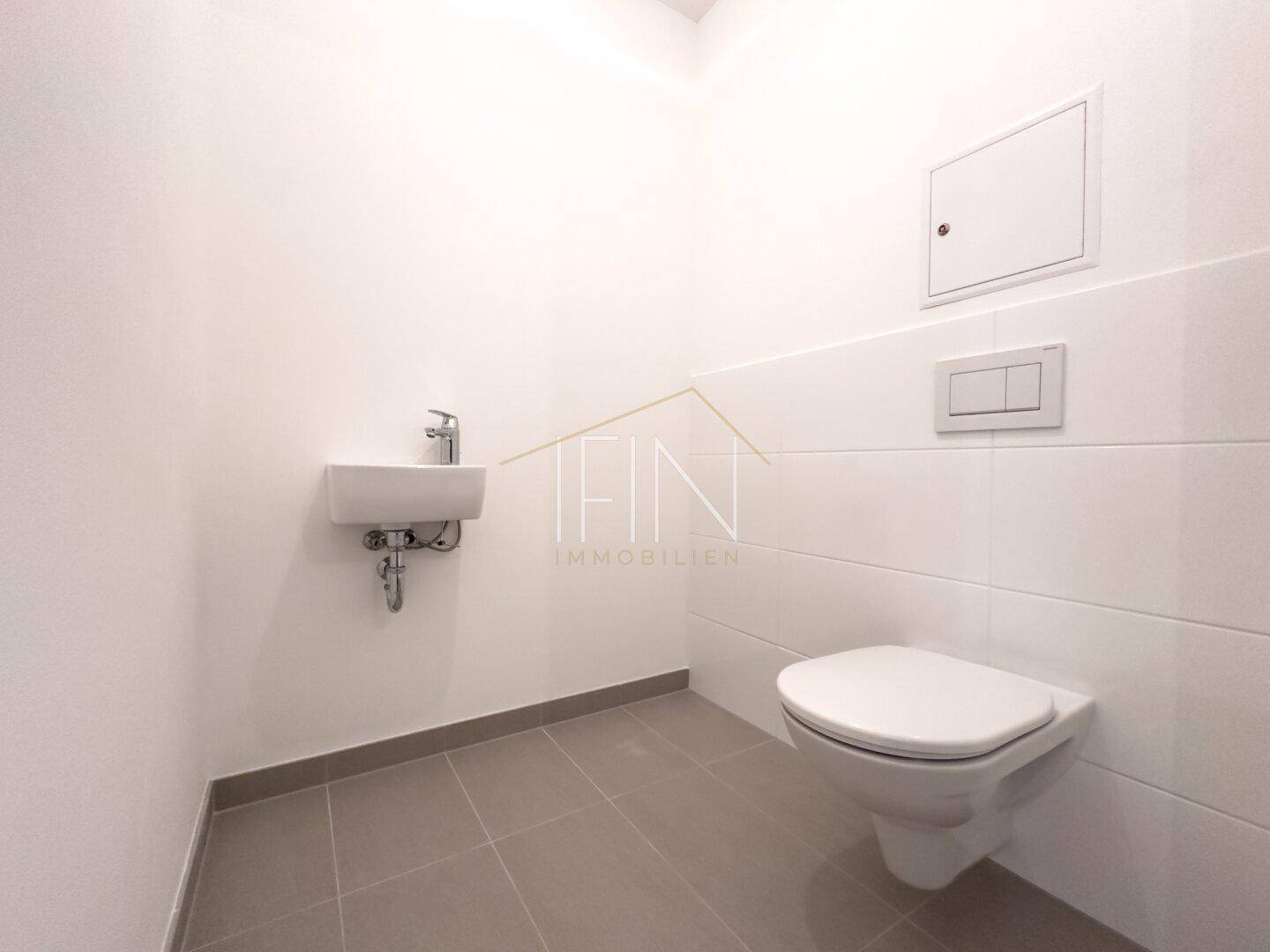 Toilette mit Handwaschbecken