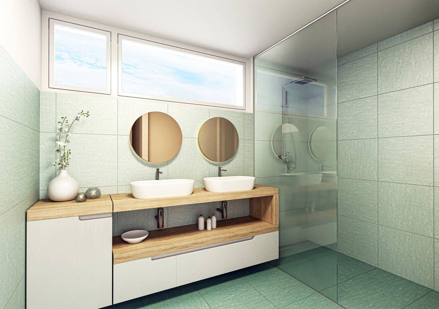 Modernes Badezimmer mit Doppelwaschbecken, großer Dusche und hellgrünen Fliesen.