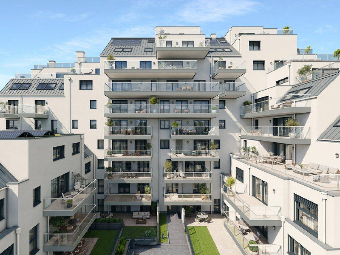 Ansicht der modernen Wohnanlage mit zahlreichen Balkonen, Terrassen und Dachgärten.