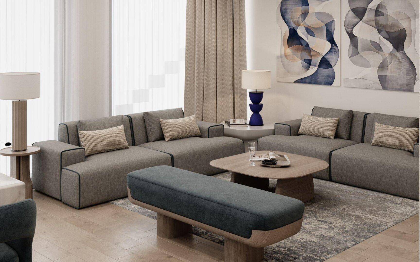 Modernes Wohnzimmer mit bequemen grauen Sofas, Holzboden und abstrakter Kunst an der Wand.