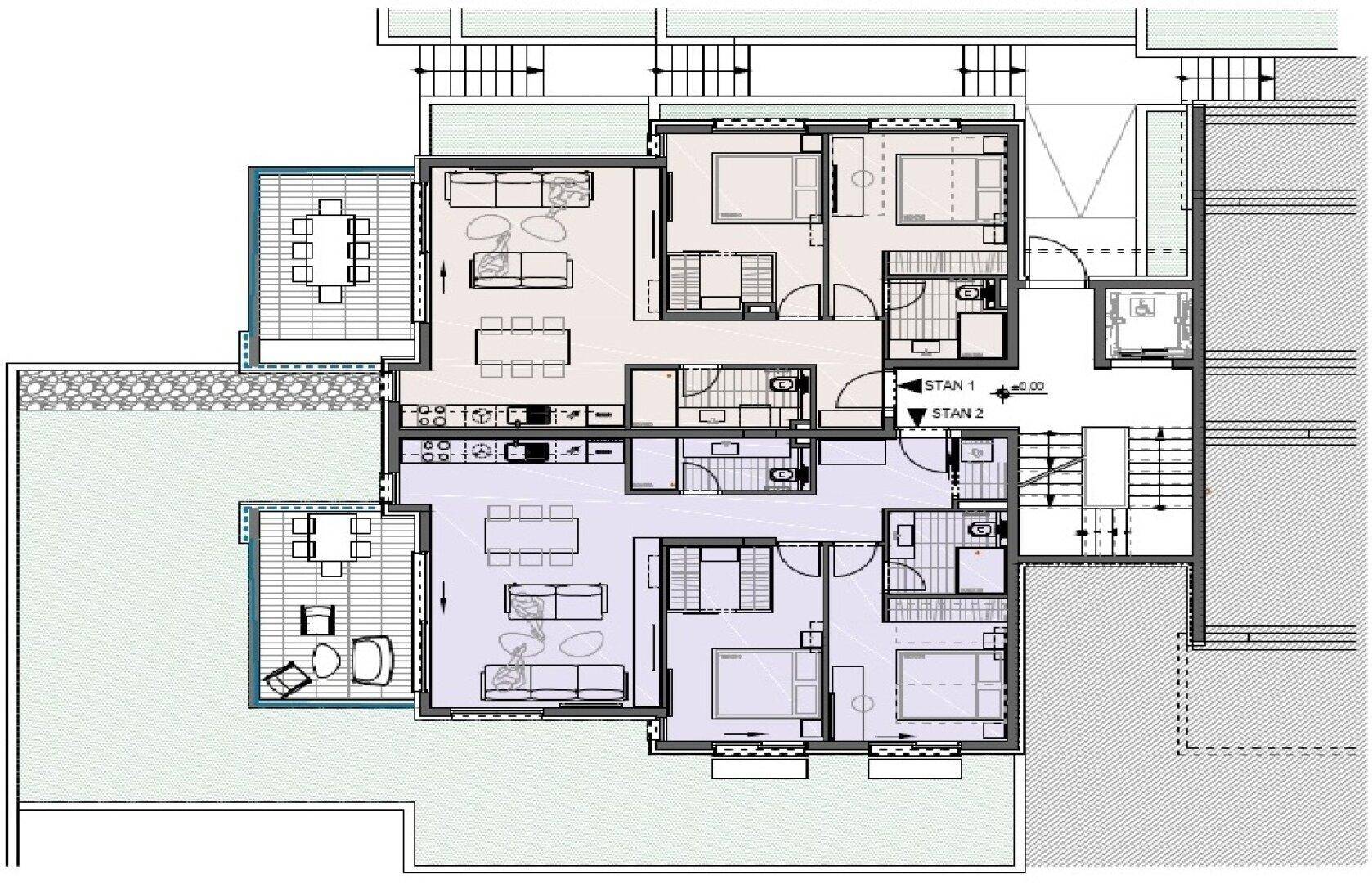 Grundriss einer Etage mit zwei Wohnungen, jeweils mit offener Küche und Terrasse.