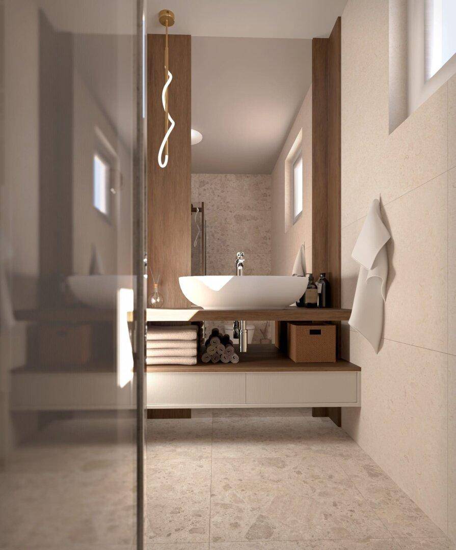 Modernes Badezimmer mit elegantem Einzelwaschbecken, Holzdetails und hellen Fliesen.