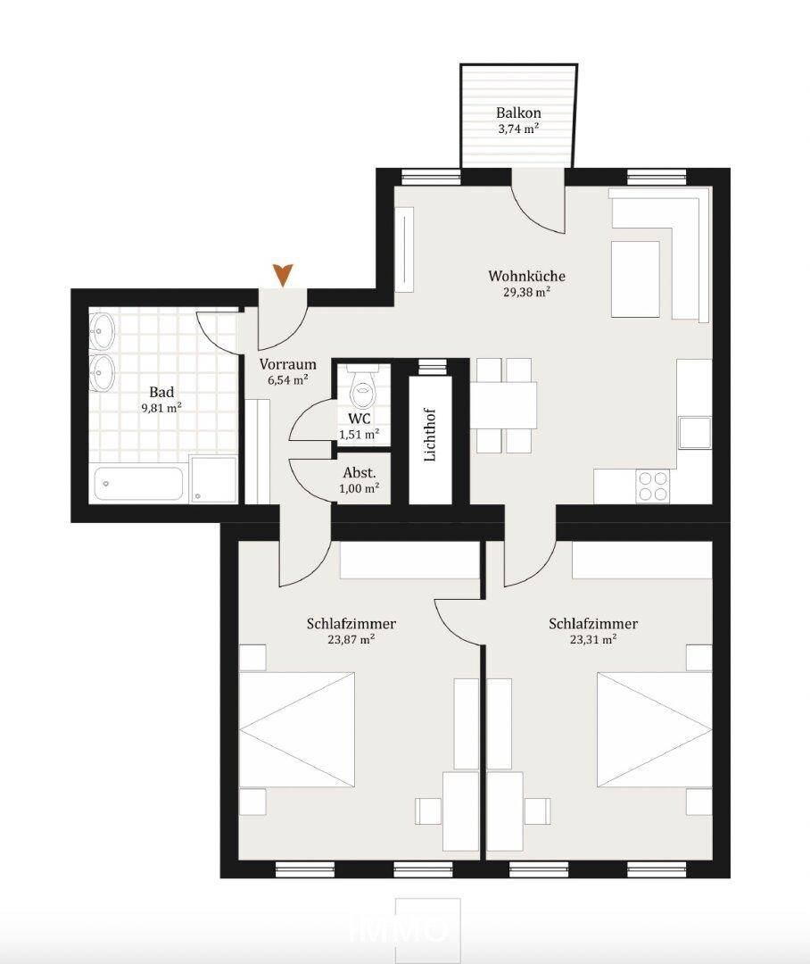 Grundriss einer Wohnung mit Wohnküche, zwei Schlafzimmern, Bad und Balkon.