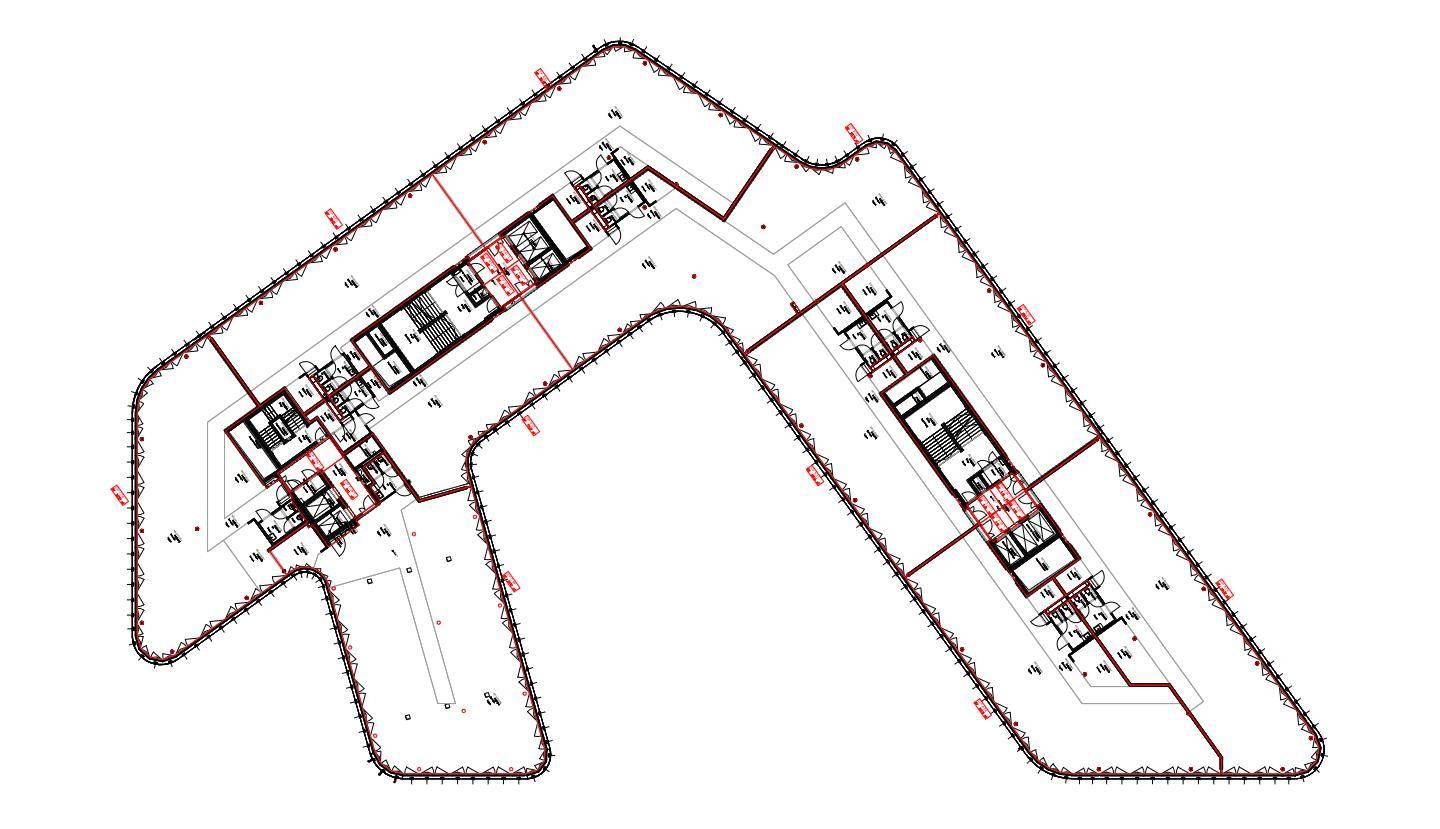 Detaillierter Grundriss eines großen, V-förmigen Gebäudes mit mehreren Einheiten und komplexer Struktur.