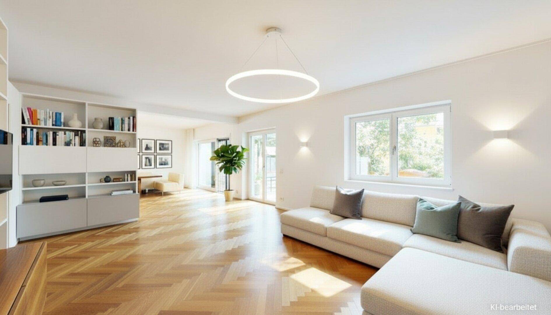 Modern eingerichtetes Wohnzimmer mit Bücherregal, Parkettboden und Zugang zur Terrasse.