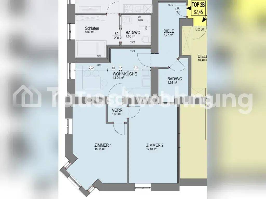 Grundriss einer Wohnung mit Wohnküche, zwei Zimmern und zwei Bädern.