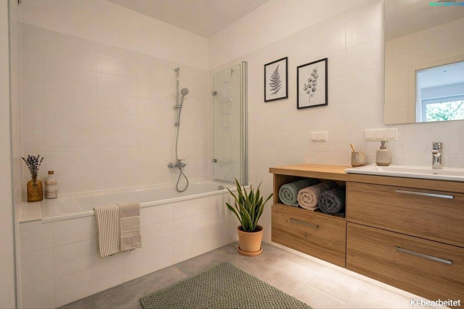 Modernes Badezimmer mit Badewanne, Holzwaschtisch und weißen Fliesen.