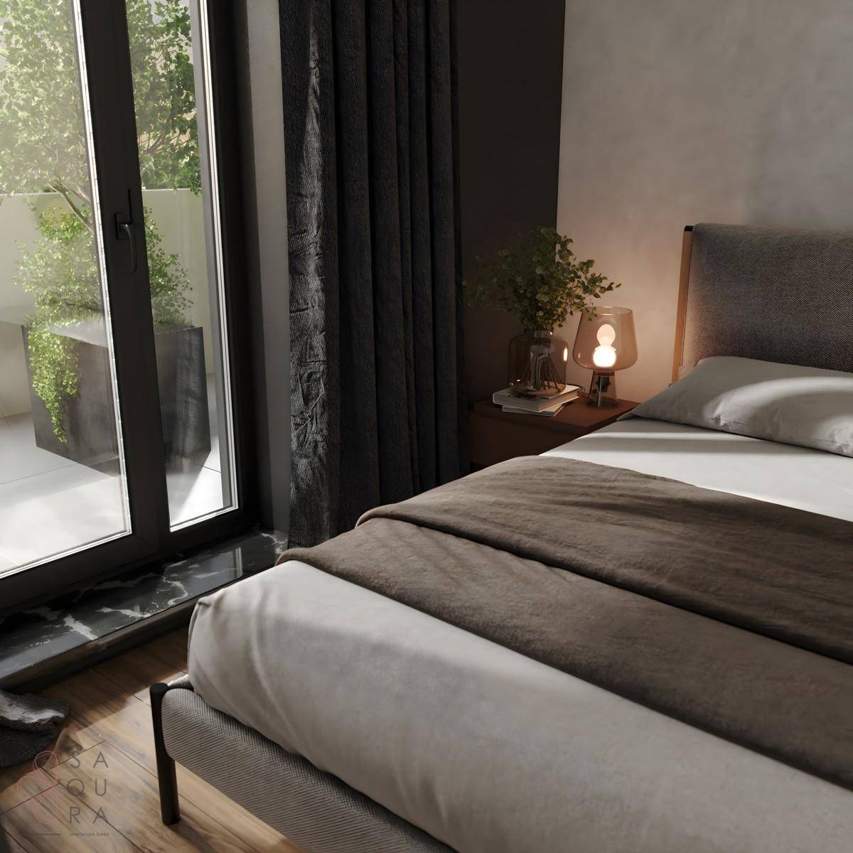 Gemütliches Schlafzimmer mit Zugang zu einem Außenbereich und dunklen Vorhängen.