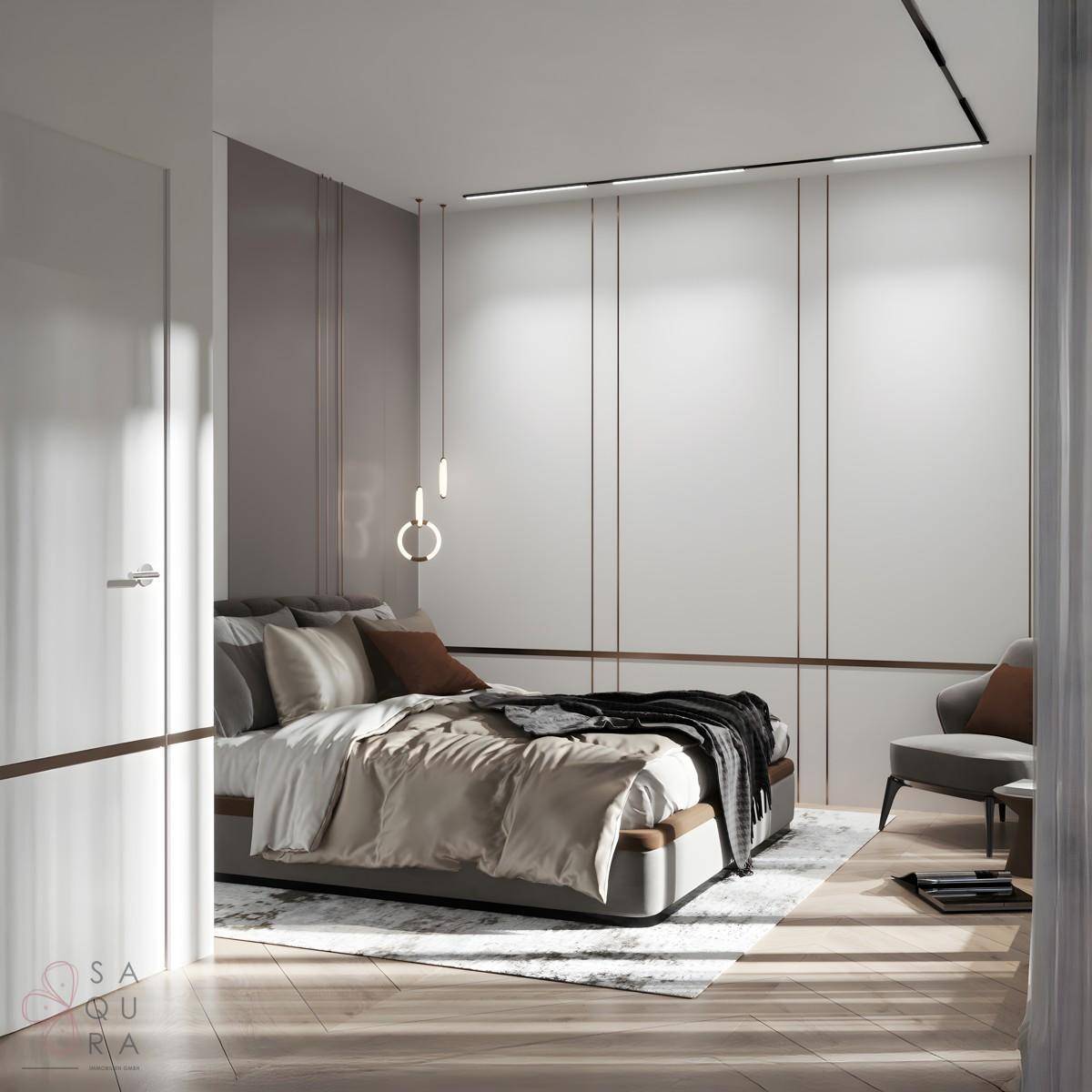 Helles Schlafzimmer mit integrierten Schränken, modernem Bett und minimalistischer Einrichtung.