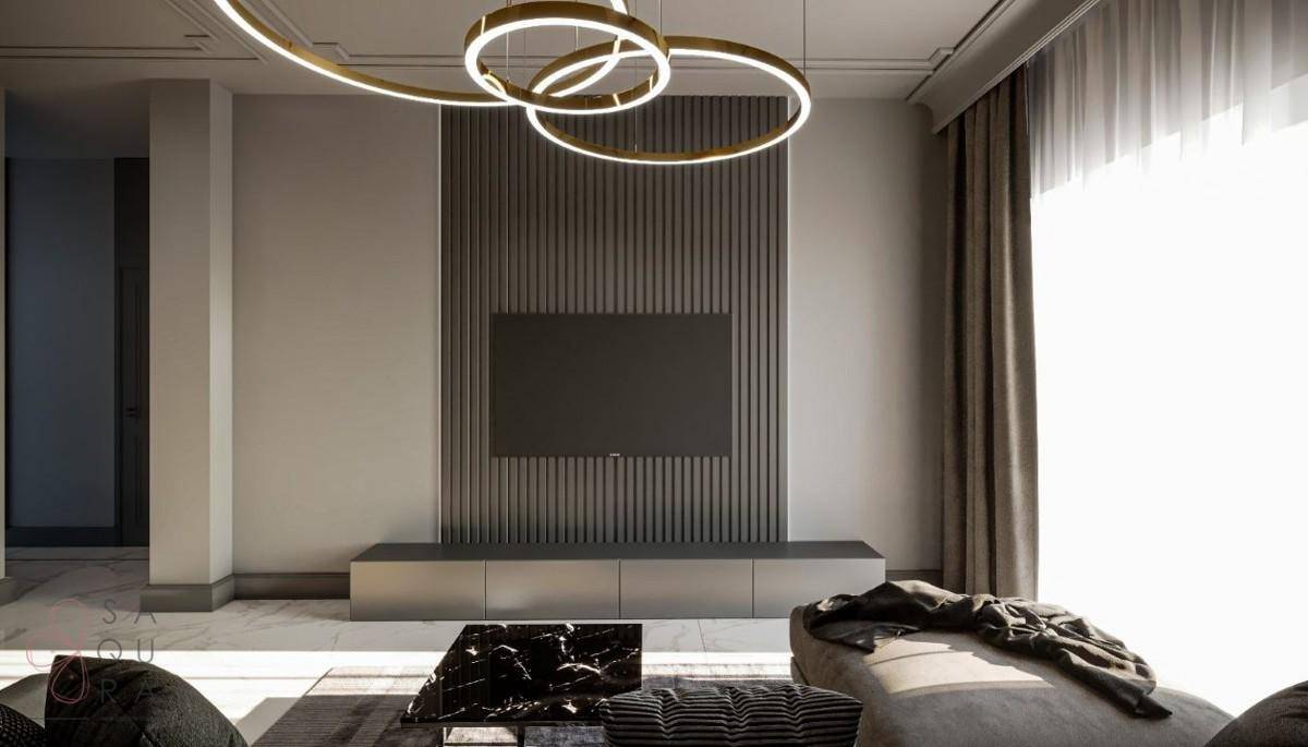 Modernes Wohnzimmer mit minimalistischer TV-Wand, eleganten Möbeln und viel Tageslicht.