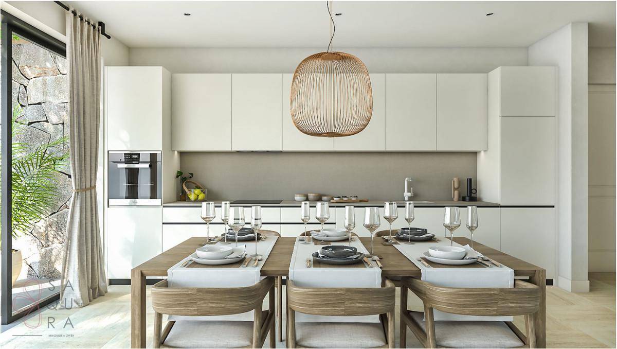 Moderne Küche mit integriertem Essbereich und minimalistischen weißen Schränken.