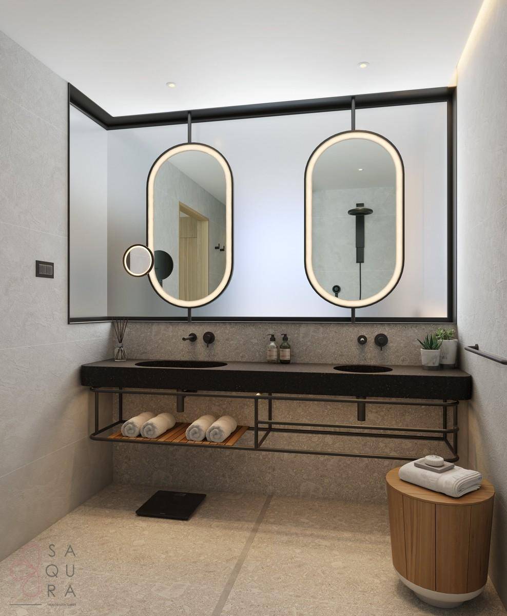 Modernes Badezimmer mit Doppelwaschbecken, großen Spiegeln und hellen Fliesen.