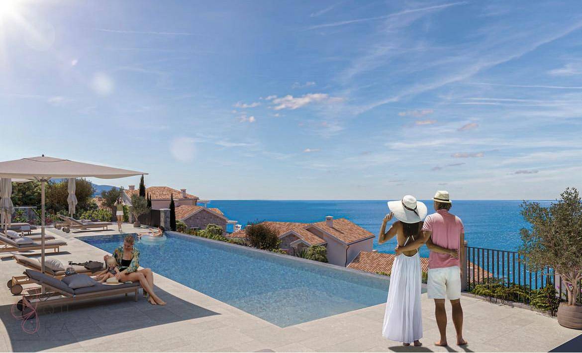 Infinity-Pool mit Meerblick und Liegeflächen, ideal zum Entspannen und Sonnenbaden.