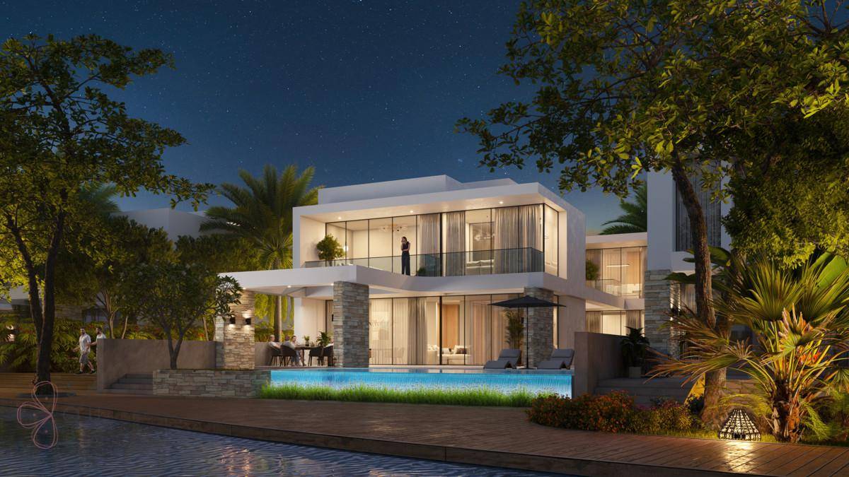 Die moderne Villa bei Nacht, elegant beleuchtet, mit glitzerndem Pool und üppiger tropischer Bepflanzung.