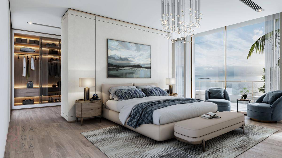 Luxuriöses Schlafzimmer mit Meerblick, raumhohen Fenstern und begehbarem Kleiderschrank.