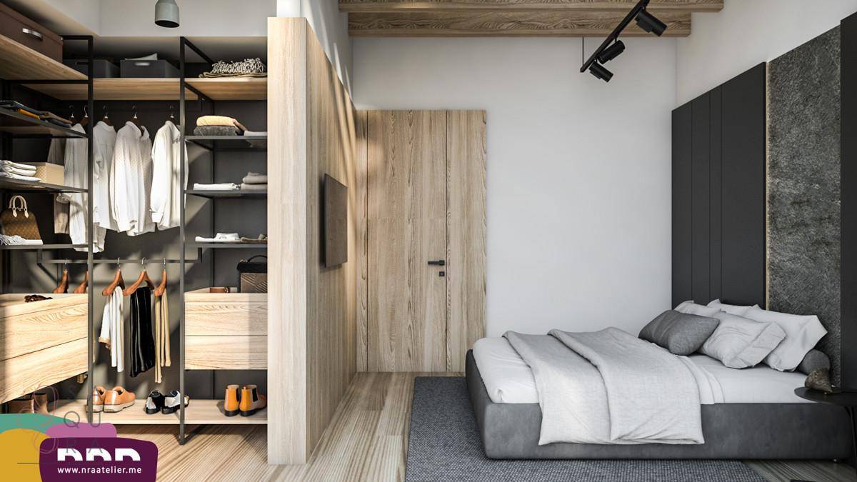 Schlafzimmer mit integriertem begehbarem Kleiderschrank und Holzakzenten für eine moderne Atmosphäre.