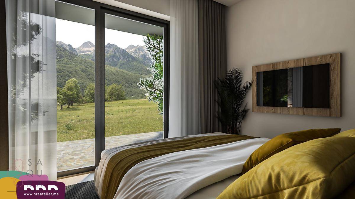 Helles Schlafzimmer mit großen Schiebetüren, die einen weiten Blick auf die grüne Landschaft bieten.