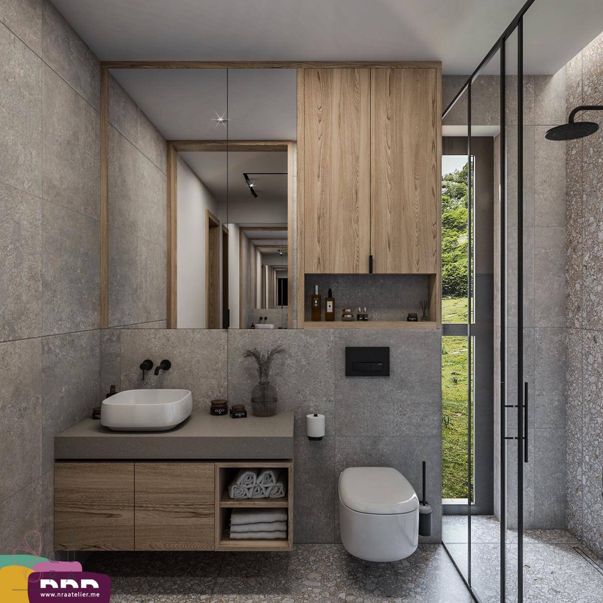 Modernes Badezimmer mit begehbarer Dusche, Waschtisch und Fenster mit Blick ins Grüne.