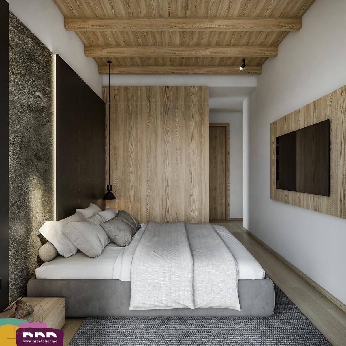 Gemütliches Schlafzimmer mit Holzbalkendecke, Holzwänden und Blick ins Grüne.