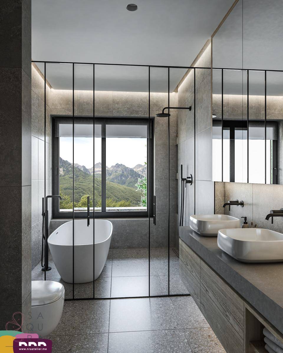 Modernes Badezimmer mit freistehender Badewanne, Doppelwaschbecken und Bergblick durch das Fenster.