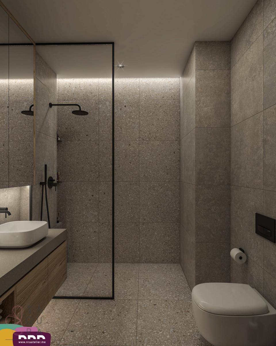 Modernes Badezimmer mit begehbarer Dusche und dunklen Fliesen, minimalistisch gestaltet.