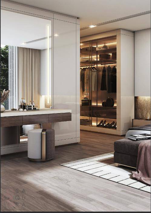 Detailansicht des eleganten Schminktisches und des begehbaren Kleiderschranks im Schlafzimmer.