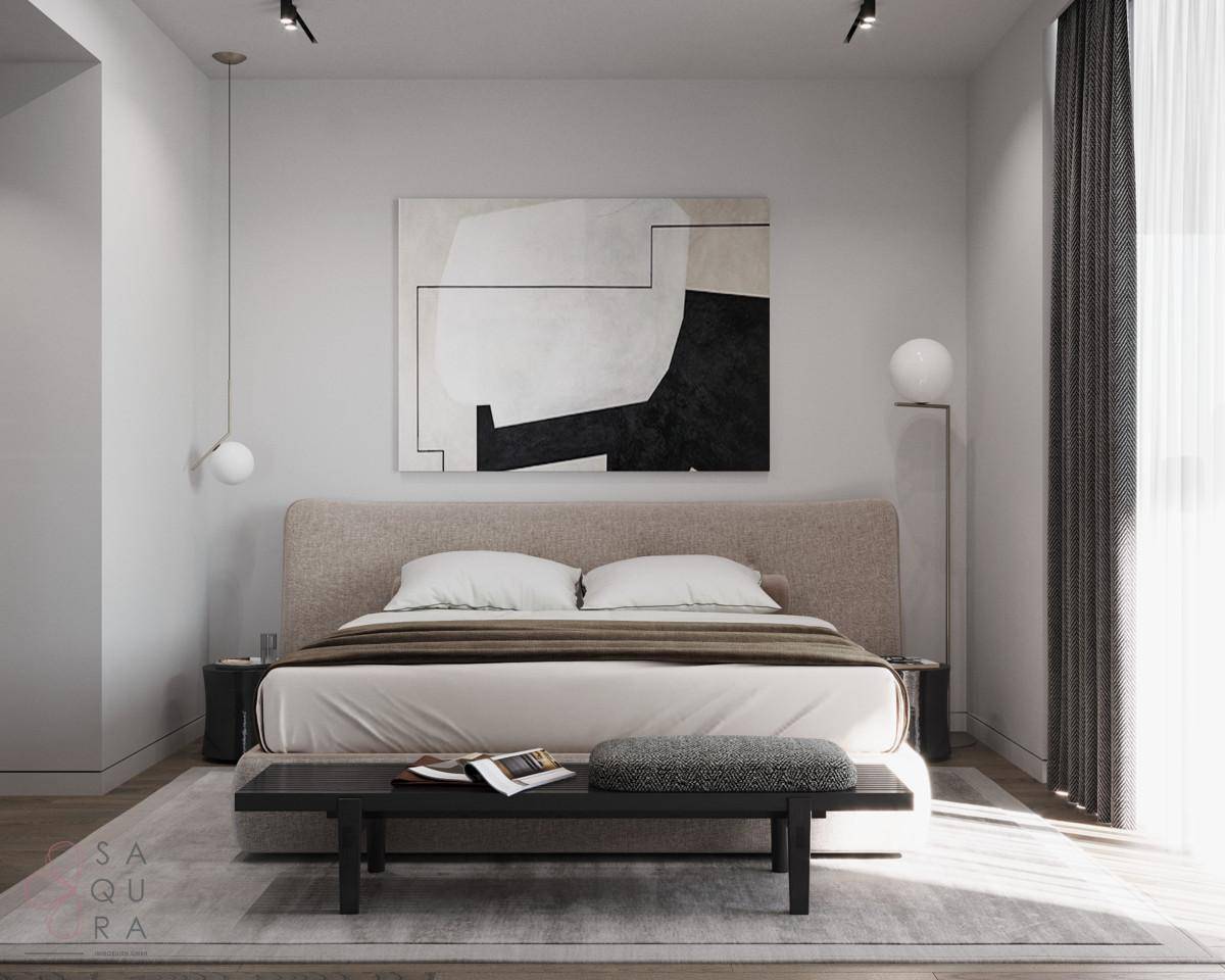 Geräumiges Schlafzimmer mit großem Doppelbett, minimalistischer Einrichtung und viel Tageslicht.