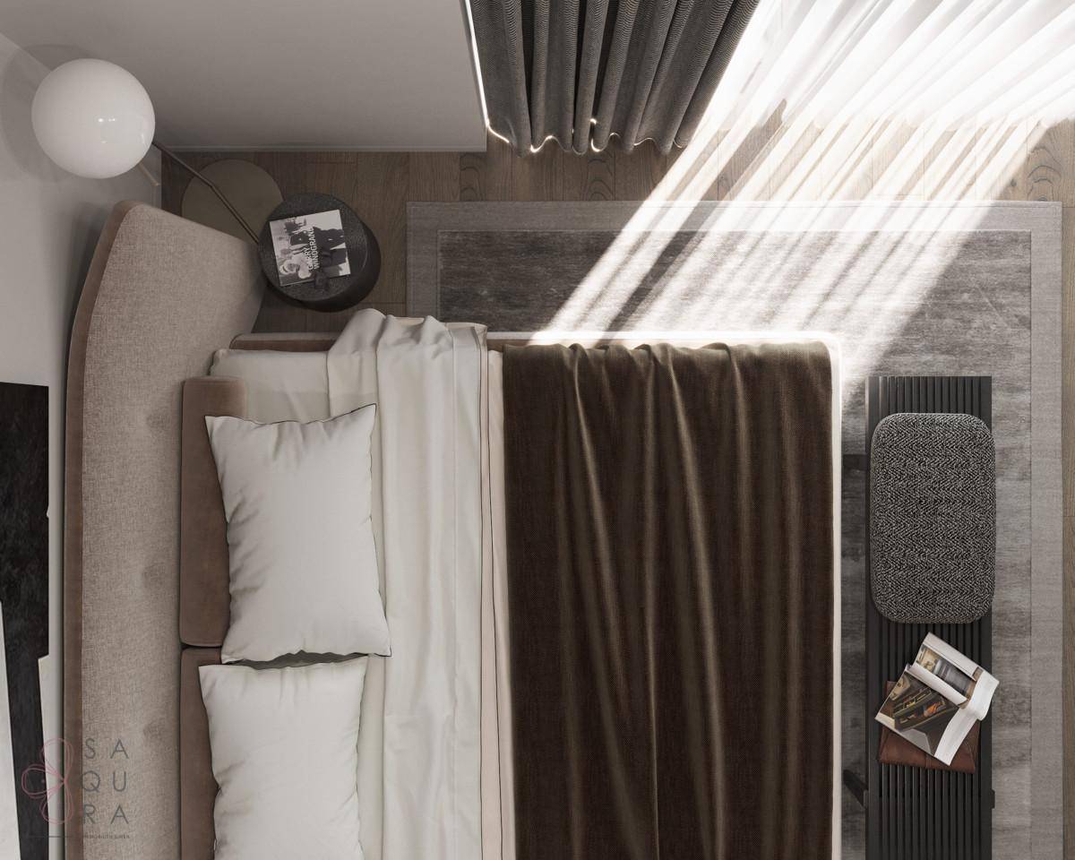 Draufsicht auf ein gemütliches Schlafzimmer mit Doppelbett und viel Sonnenlicht.