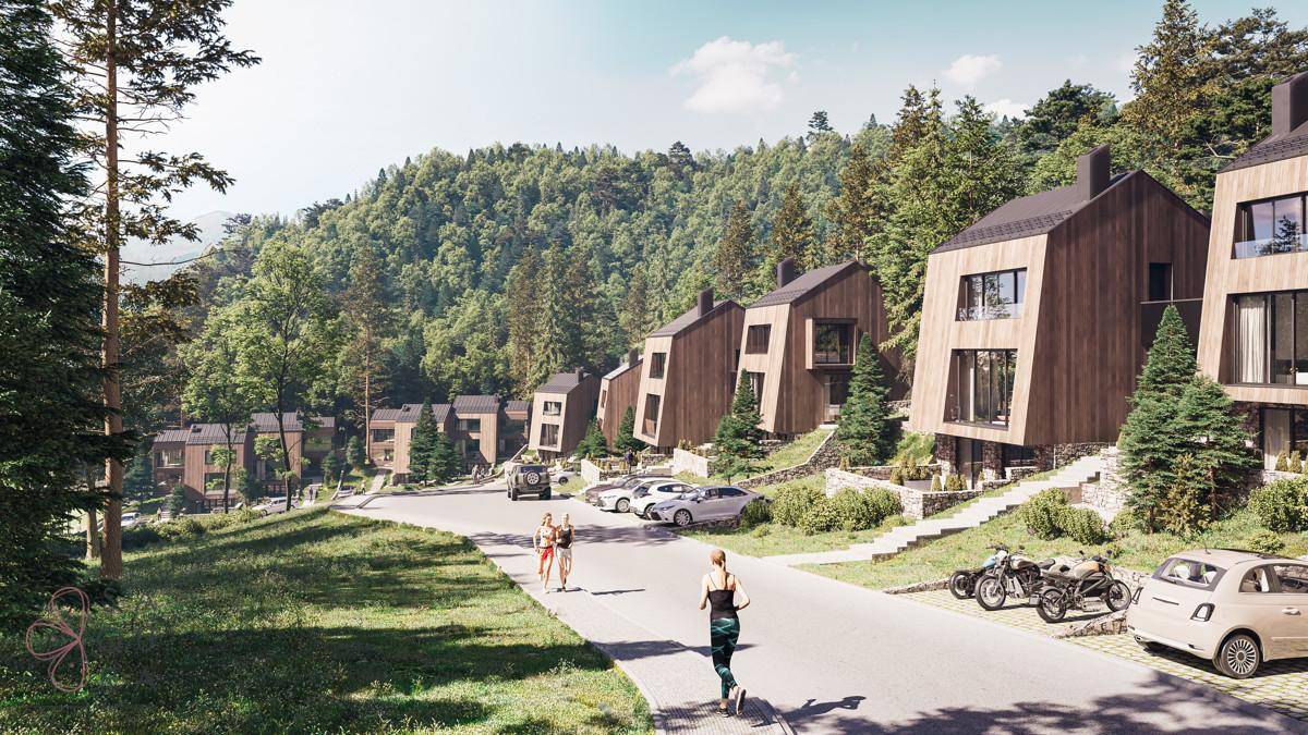 Moderne Holzhäuser in einer grünen Waldlandschaft mit Wegen für Spaziergänger und Jogger.