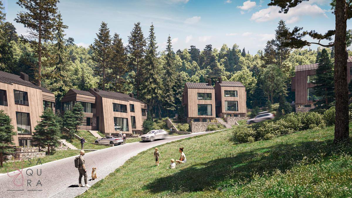 Moderne Holzhäuser in einer grünen Waldlandschaft mit Spazierwegen und viel natürlichem Licht.