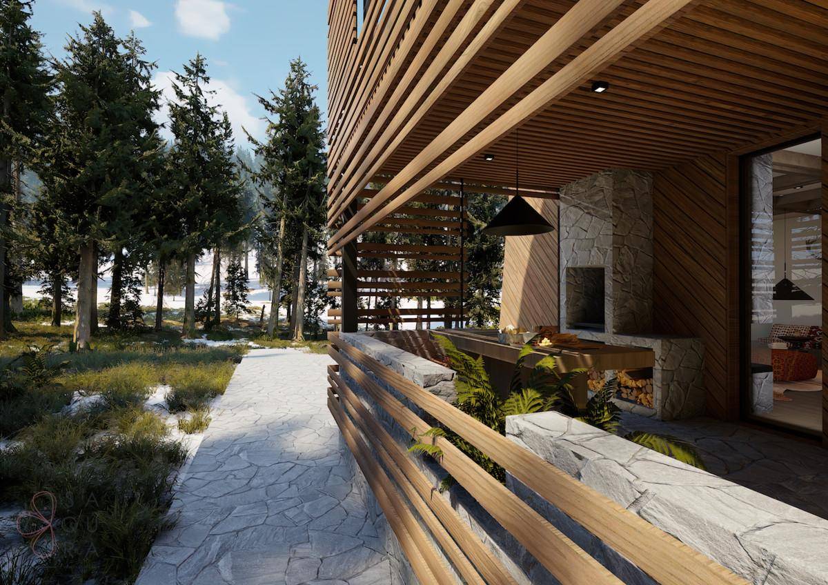 Überdachte Terrasse mit Außenküche und Grillbereich, umgeben von verschneiter Natur.
