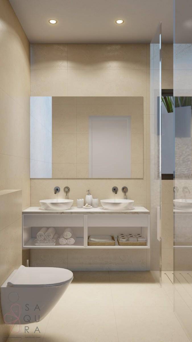Modernes Badezimmer mit Doppelwaschbecken, Wand-WC und großen Fliesen.