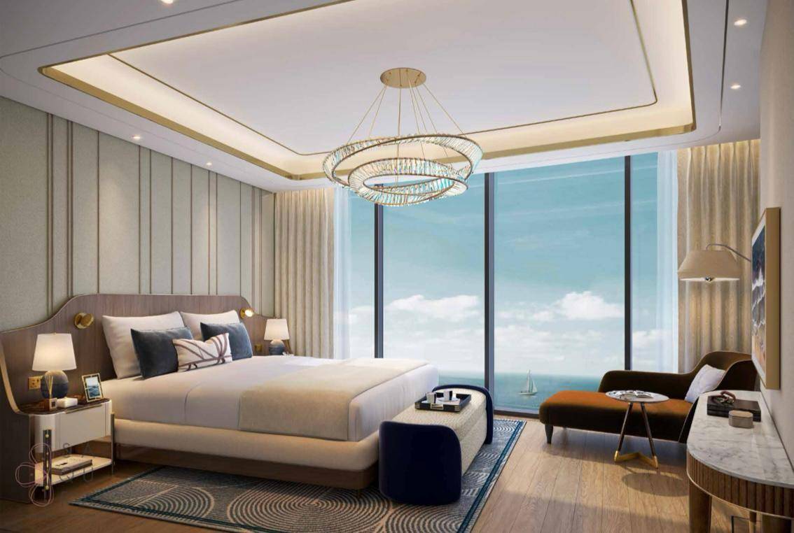 Luxuriöses Schlafzimmer mit raumhohen Fenstern und atemberaubendem Meerblick.