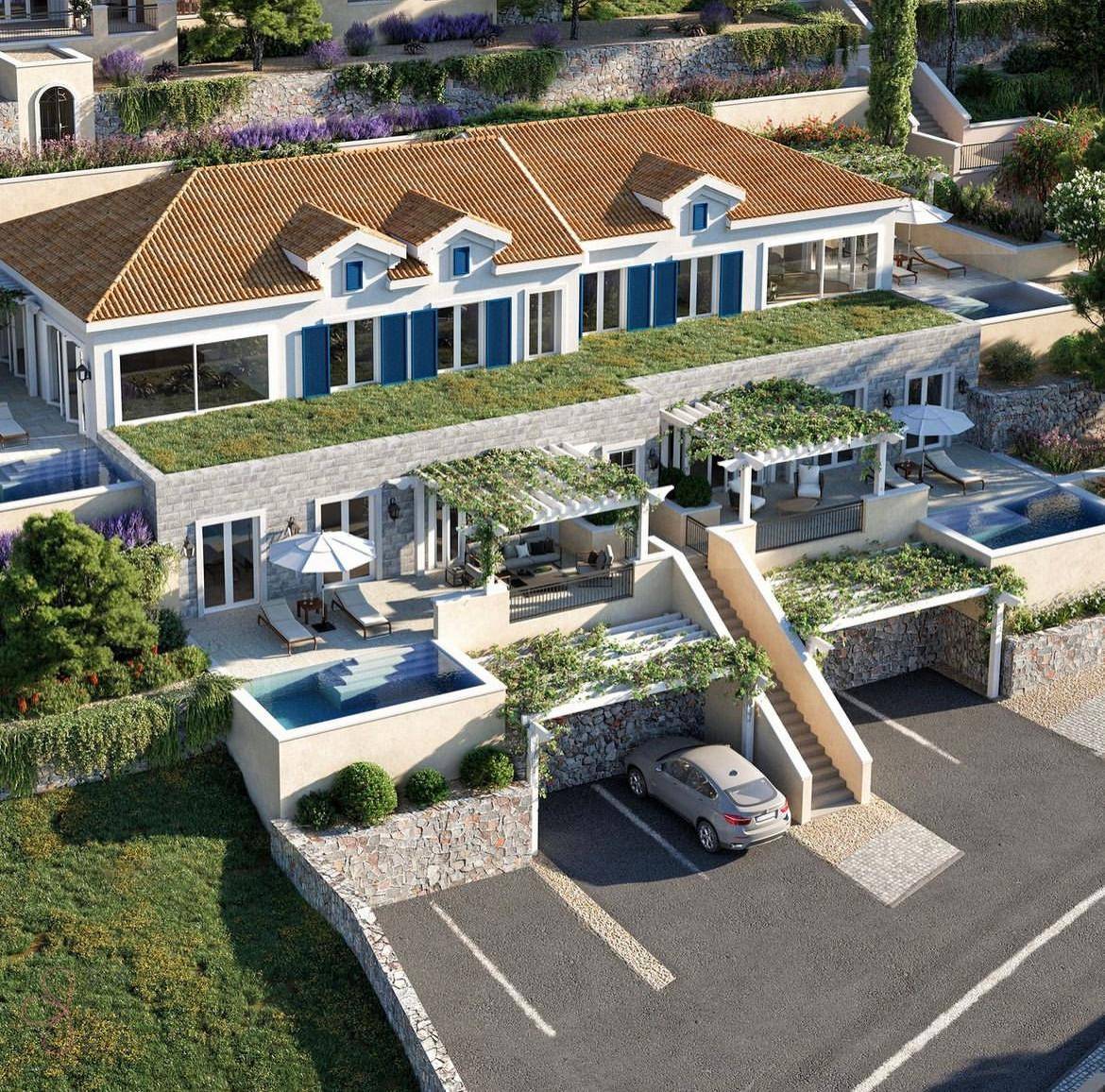 Luxuriöse Wohnanlage mit mehreren Villen, Pools und Tiefgaragenstellplätzen.