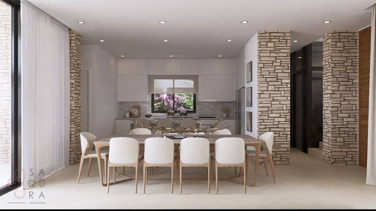Eleganter Essbereich mit großem Holztisch und offener Verbindung zur modernen Küche.