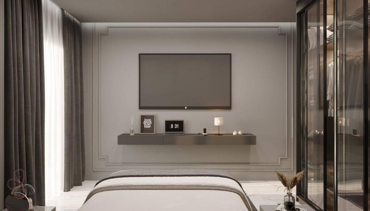 Schlafzimmer mit Wandfernseher, schwebendem Regal und eleganten Wandleisten, die eine moderne Ästhetik betonen.