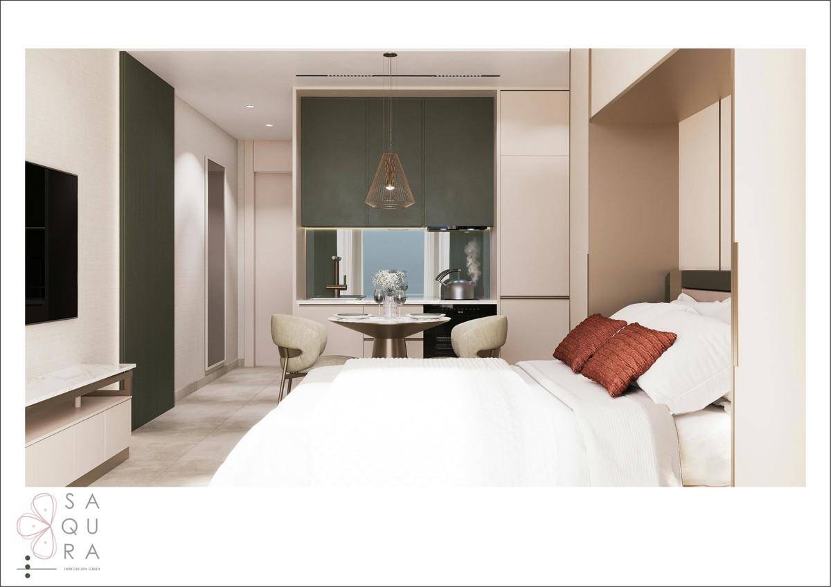 Modernes Studio-Apartment mit Schlafbereich, Essplatz und integrierter Küchenzeile.