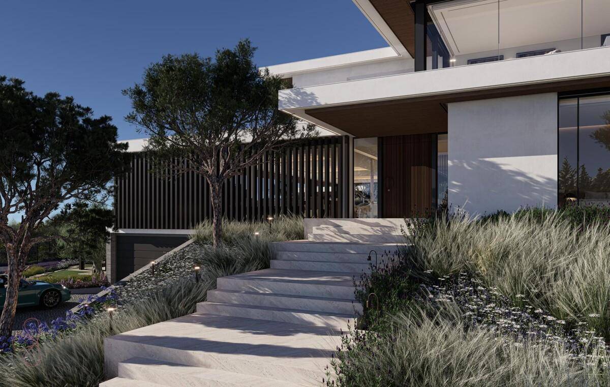 Elegante Steintreppe führt zum Eingang der modernen Villa, umgeben von mediterraner Bepflanzung.