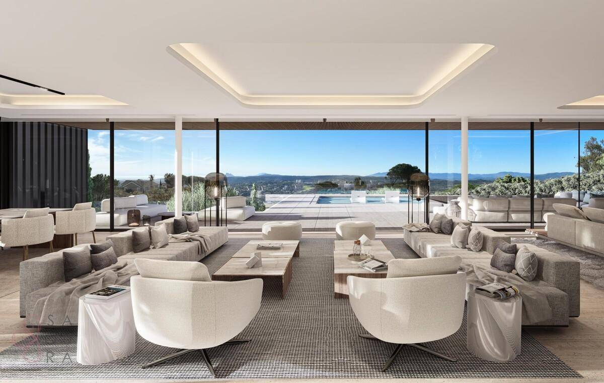 Geräumiges Wohnzimmer mit moderner Einrichtung, hohen Decken und Panoramablick.