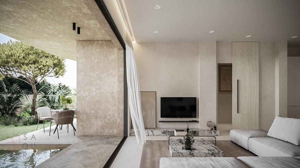Helles Wohnzimmer mit modernen Möbeln, Marmor-Details und direktem Zugang zum Garten.