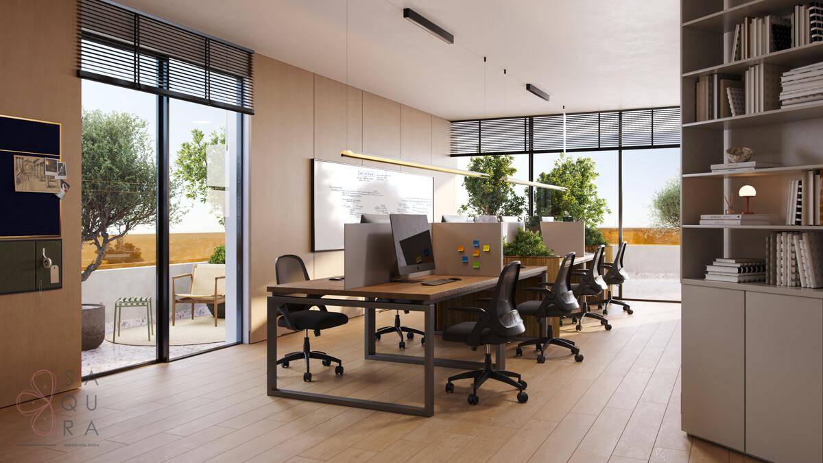 Helles Büro mit großen Fenstern, modernen Arbeitsplätzen und Zugang zu einem Außenbereich.