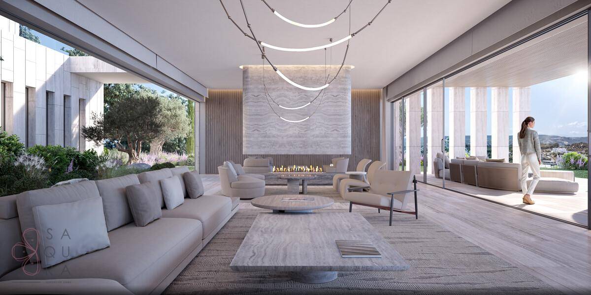 Geräumiges Wohnzimmer mit eleganten Möbeln, Kamin und großen Schiebetüren zur Terrasse.