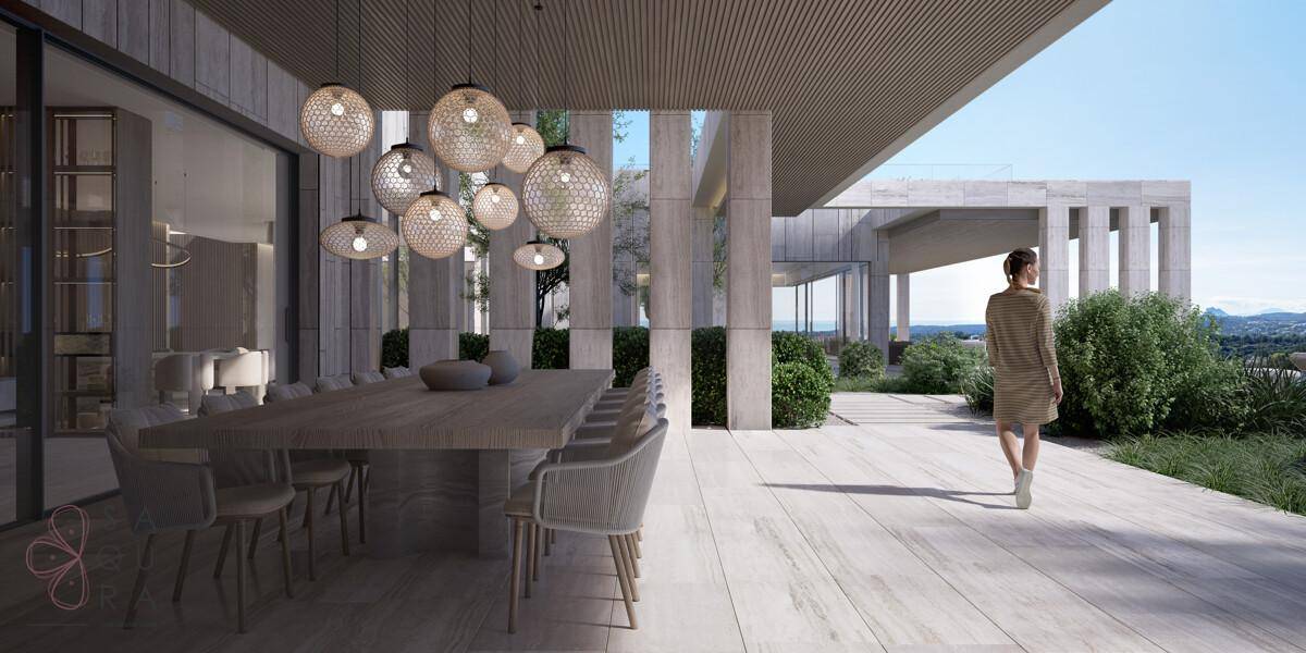 Großzügige Terrasse mit Essbereich im Freien und stilvollen Hängelampen, umgeben von Natur.