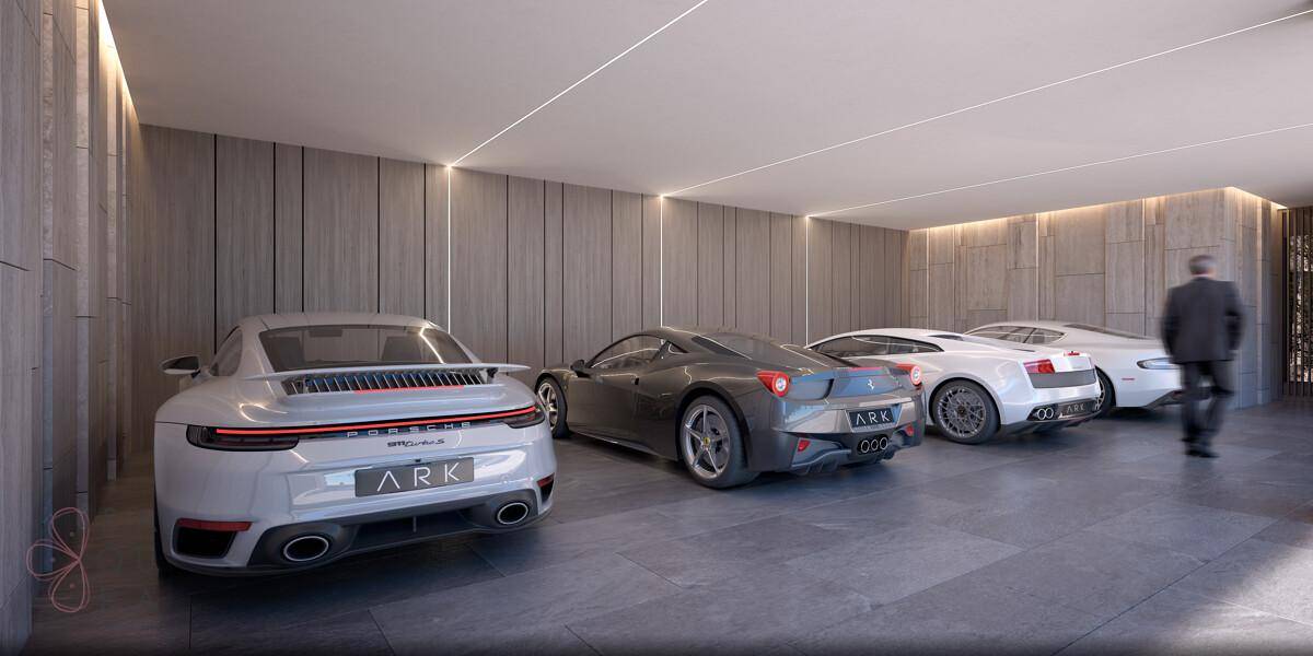 Geräumige Tiefgarage mit mehreren Luxusautos und moderner Beleuchtung.