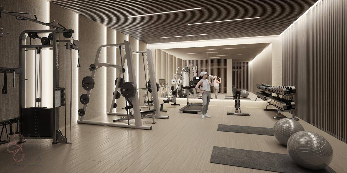 Gut ausgestatteter Fitnessraum mit verschiedenen Geräten für ein umfassendes Training.