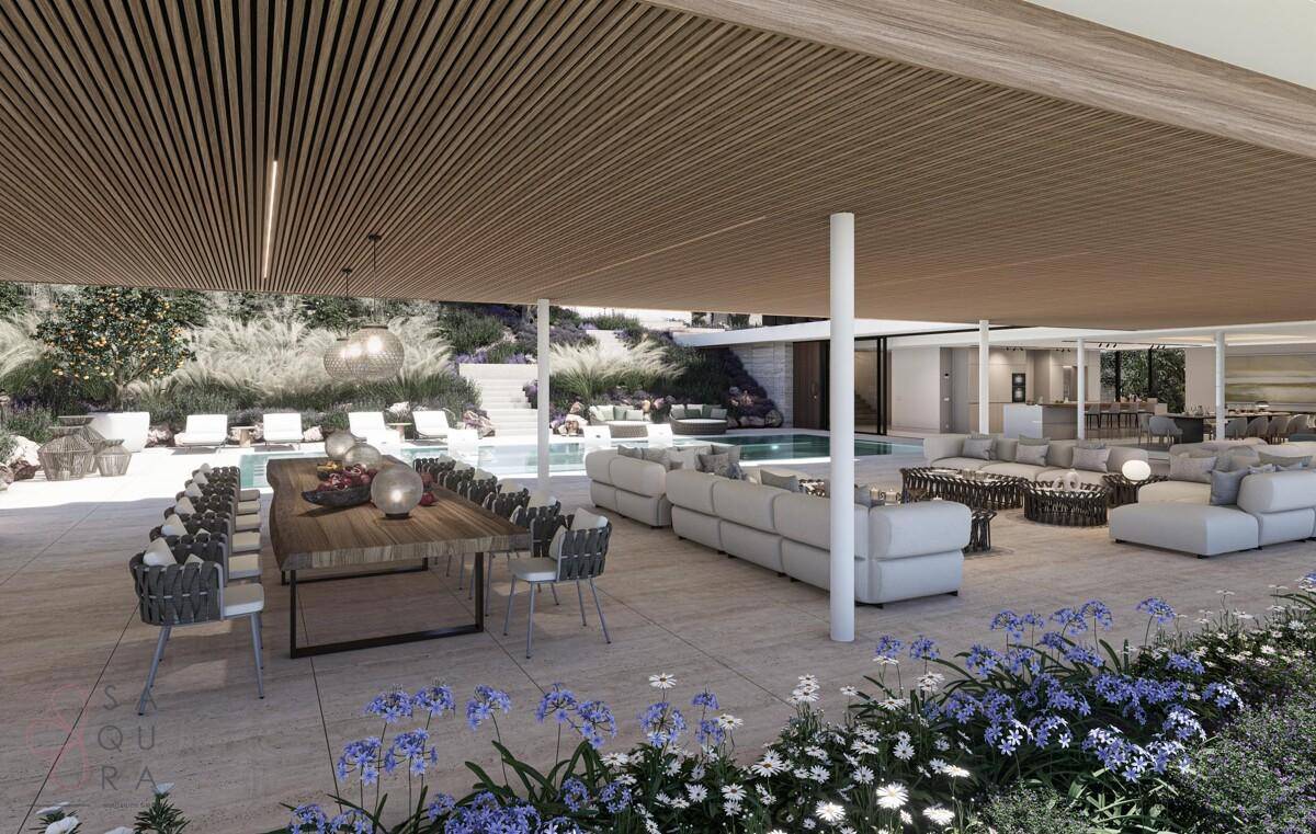 Überdachte Terrasse mit großem Esstisch und Lounge-Bereich am Pool.
