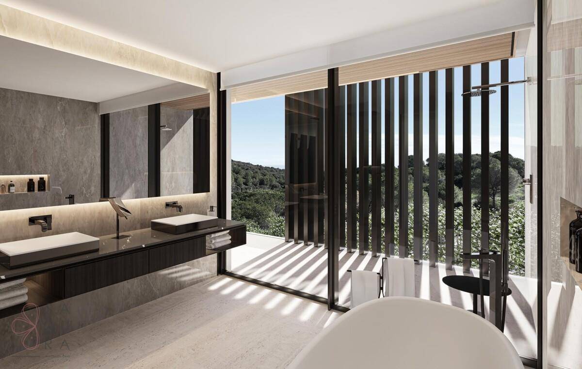 Modernes Badezimmer mit Doppelwaschbecken, freistehender Badewanne und Waldblick.